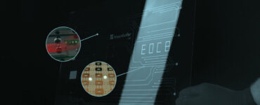 Single layer glass printed circuit board and optical fibers integrated in glass, Fraunhofer IZM