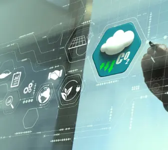 A person is using a transparent, futuristic touchscreen display featuring weather icons and data readouts